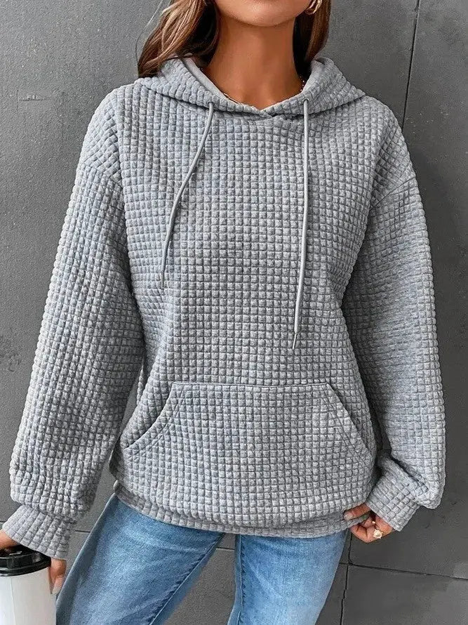 Pull ample décontracté à manches longues.