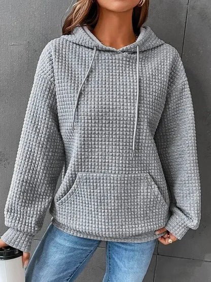 Pull ample décontracté à manches longues.