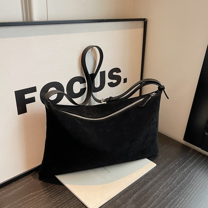 Sac de niche en daim.